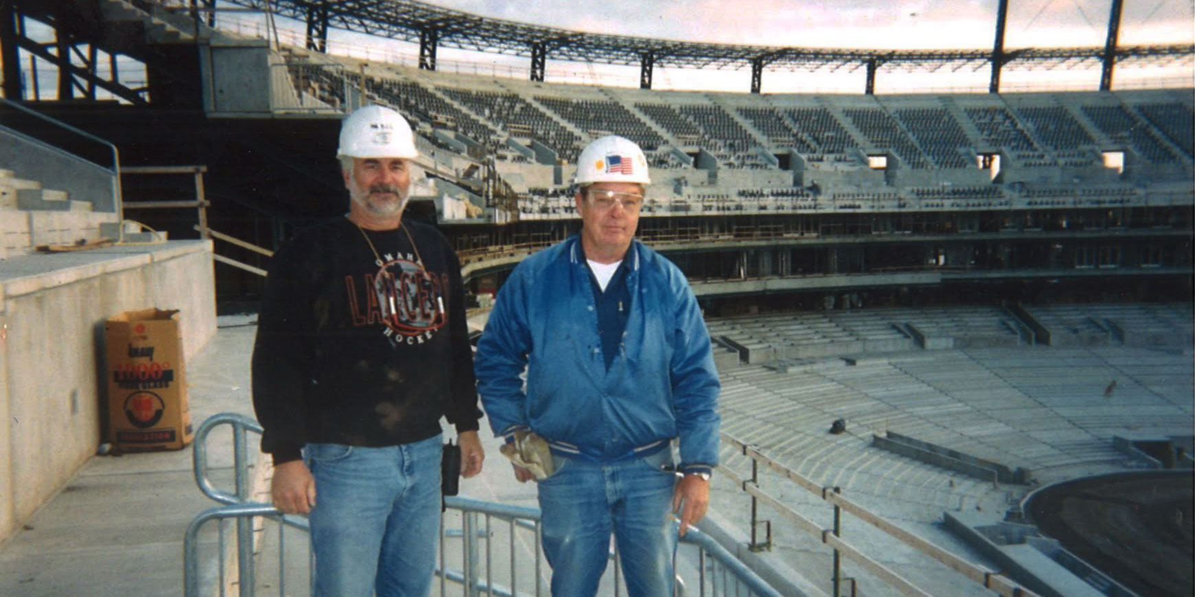 Image of two members in a stadium